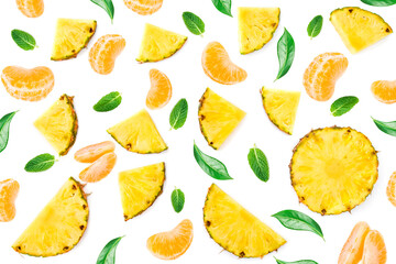 Summer Pattern with fruits and berries isolated on white background. Pineapple , mandarine, and  green  leaves Flat lay. Top view. Creative layout