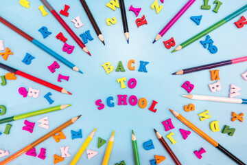 Back to school from colored letters and multicolored pencils