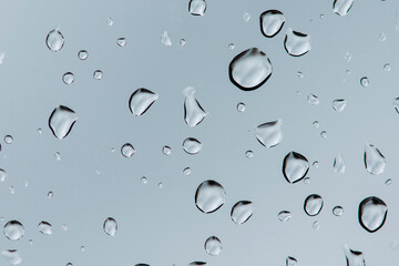 Water backgrounds with water drops. Blue water bubbles on window glass.