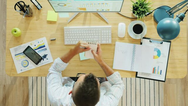 Day To Night Time Lapse Of Motivated Young Businessman Working Sitting At Desk Typing With Computer During Day Then Sleeping At Night. People And Technology Concept.