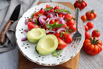 Fresh healthy Avacado and Tomato Salad with Onions