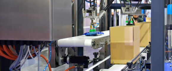  cardboard boxes on conveyor belt. parcels transportation system concept