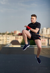 Kickbox fighter training in urban environment