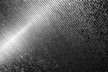 Black and white stylization of the greenhouse surface made of plastic covered with grooves and raindrops