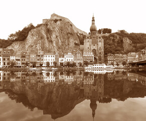 Reflections of the the Citadel and the Collegiate Church of Our Lady on the Meuse River, Dinant, Belgium in Sepia Color