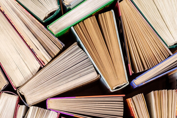 Book background. Old books in the library. Flatlay top view