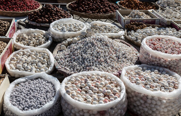 fruits and berries in sugar on the rural market iroadside market in Asia