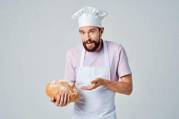 bearded man in white apron bread baking service