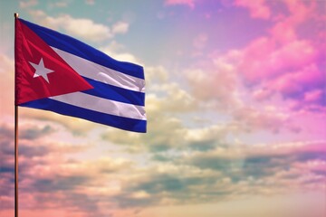 Fluttering Cuba flag mockup with the space for your content on colorful cloudy sky background.