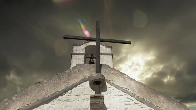 A symbolic combination of clips, representing the crisis of the Catholic Church: a steeple, with dark clouds in the sky (time-lapse).
