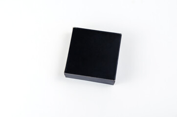 Small Square black gift box on white background. Paper box for w