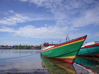 Fototapeta na wymiar Southeast Asian fishing boat on the beach 