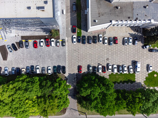 Aerial view of urban parking lot near business center. Top drone point of view. Carpark spot in a European city © troyanphoto