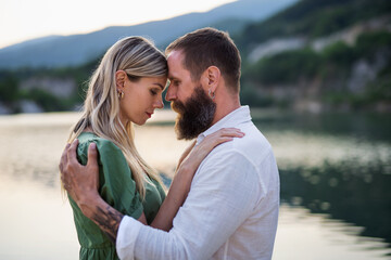 Obraz premium Happy mature couple in love hugging in nature.