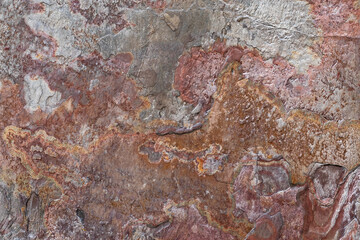 Texture of the brown wall. Grunge stone backdrop, abstract background, granite textures, old tile, decay, natural pattern, dirty wallpaper. Rusty surface.