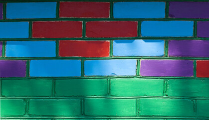 Colored colorful brick wall as texture background.