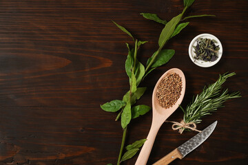 Fototapeta na wymiar Fresh herbs and spices on wooden table. Top view with copy space for text. Fresh organic green fragrant herbs. Aromatic ingredients for cooking. Healthy concept