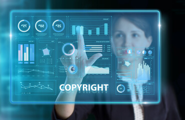 Business, Technology, Internet and network concept. Young businessman working on a virtual screen of the future and sees the inscription: Copyright