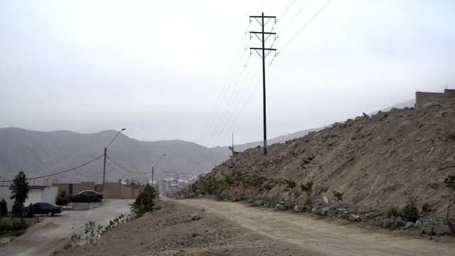 Real Estate Construction Site Area with Side Road Panning Down with Bird Flying in Sol La Molina, Lima, Peru