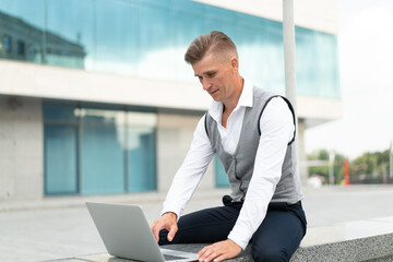 Business. Businessman Using Laptop Outdoors. Modern Technology Concept