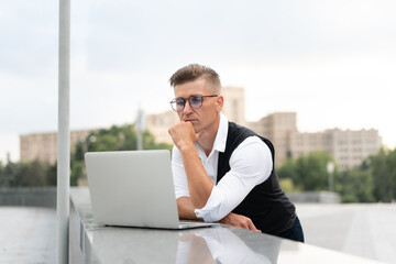 Business. Businessman Using Laptop Outdoors. Modern Technology Concept