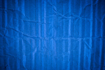 Crumpled blue cardboard texture.