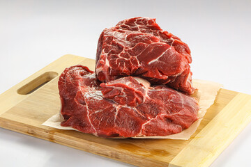 Raw beef neck over board