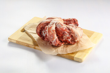 Raw lamb neck over board
