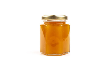 Glass jar full of sweet honey isolated on white background