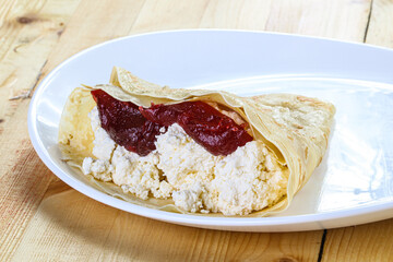 Pancake with cottage cheese and jam