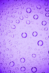 Water bubble on .purple glass.