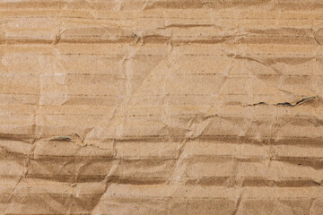 Brown cardboard torn crumpled.