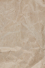 Textured crumpled packaging brown paper background.