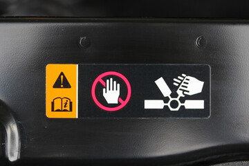 Warning label under the hood of a new vehicle