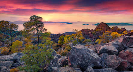 Unbelievable summer view of Saronic Islands from popular tourist destination - Methana Volcano. Rocky sunset on Peloponnese peninsula, Greece, Europe. Great Mediterranean seascape.