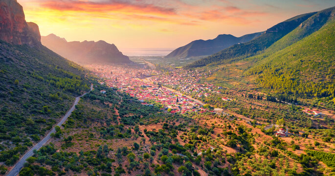 View from flying drone of Leonidio town. Unbelievable summer sunrise on Peloponnese peninsula, Greece, Europe. Traveling concept background.