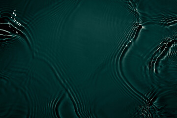 Black transparent clear calm water surface texture with ripples, splashes Abstract nature...