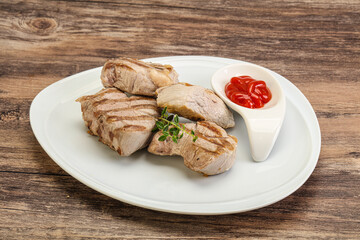 Grilled pork tenderlion with tomato sauce