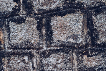 Old Temple wall. Rectangular cut out marble granite brick real surface stone with cement. Pattern...