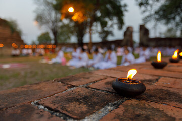 Oil lamps sparked by dharma practitioners.