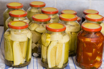 Home canned zucchini and vegetable marrow in glass jars