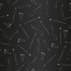Obraz premium Brushes and palette knife seamless pattern, vertical rows of silhouettes of artist drawing tools on black chalkboard