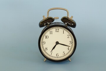 alarm clock isolated on blue background