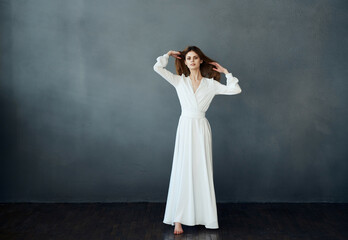 cheerful pretty woman in white dress elegant style dance performance