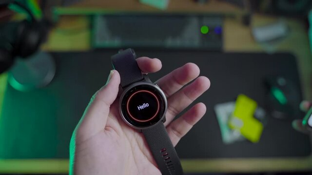 Modern lifestyle with smartwatch for fitness tracking. A men hand hold a fitnes smartwatch comparing with other smartwatch