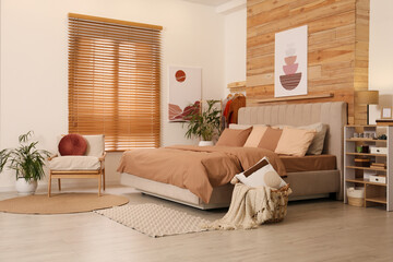 Obraz premium Comfortable bed with stylish linens. Interior design