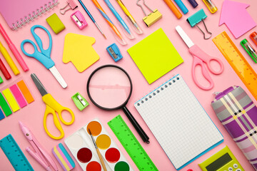 Fototapeta na wymiar School supplies on pink background with copy space. Back to school concept.