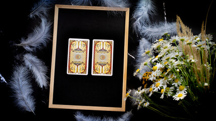 Two tarot cards on the table, choosing concept, fortune telling