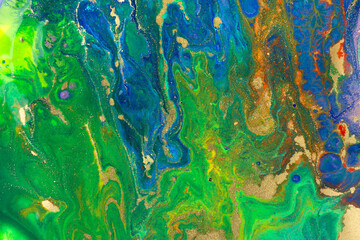 Fototapeta na wymiar Marble blue, green and gold abstract background. Navy liquid pattern with golden glitter.