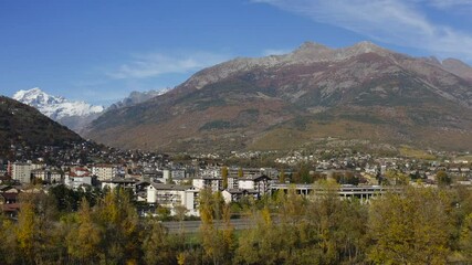 Valle d’Aosta, Italy, with a beautiful and amazing clave of mountains, and city, Drone view.